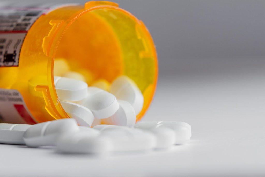 An open bottle of pills.